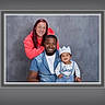Kaden joined the competition — help win amazing prizes! family, portrait, smiling, man, woman, baby, child, denim_shirt, hoodie, crown, happy, indoor, studio, gray_background, framed_photo, casual_clothing, people, toddler, posing, together