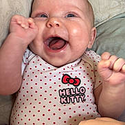 Anastasia joined the competition — help win amazing prizes! baby, infant, smiling, happy, onesie, hello_kitty, polka_dots, cheeks, face, hands, bed, blanket, soft, candid, cute, child, portrait, indoor, person, expression