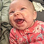Anastasia joined the competition — help win amazing prizes! baby, infant, smiling, laughing, onesie, pink_clothing, floral_pattern, face, head, drool, close_up, happy, child, person, blanket, cozy, indoor, cute, expression, soft