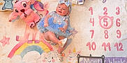Alina joined the competition — help win amazing prizes! baby, blue_dress, headband, blanket, rainbow, cloud, unicorn, plush_toy, pink_stuffed_animal, pillow, numbers, milestone_blanket, smiling, child, infant, cute, feet, shoes, lying_down, colorful