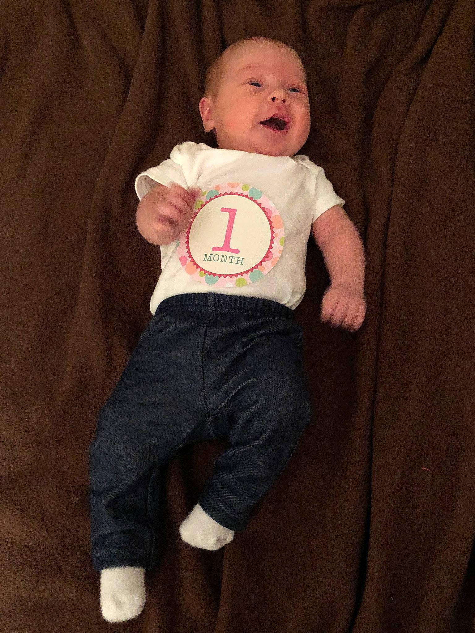 Carleigh is registered to the contest to win money with this photo: baby_products, boy, child, fun, infant, person, product, sitting, skin, smile, standing, t_shirt, textile, toddler