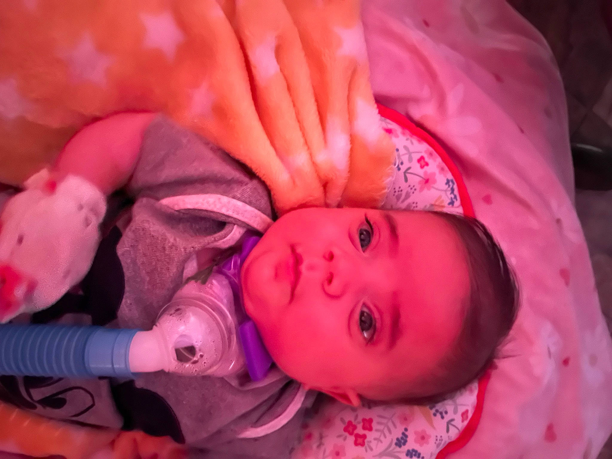 Sophia is registered to the contest to win money with this photo: baby, baby_toddler_clothing, cheek, child, comfort, eye, eyebrow, fun, gesture, head, human_body, iris, lip, mouth, nose, orange, person, pink, purple, skin