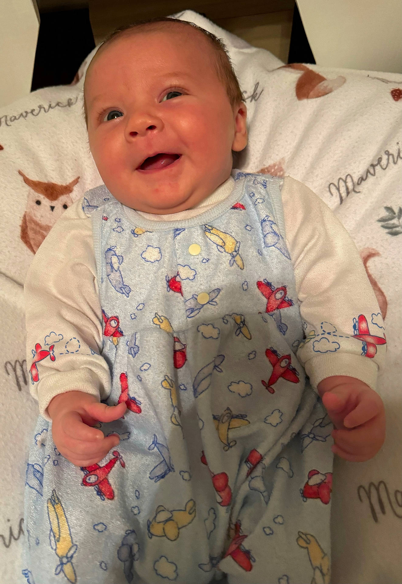 architecture, baby, bed, blanket, bodypart, building, clothing, cushion, face, finger, furniture, hand, head, hospital, newborn, pajamas, person, photography, portrait, quilt