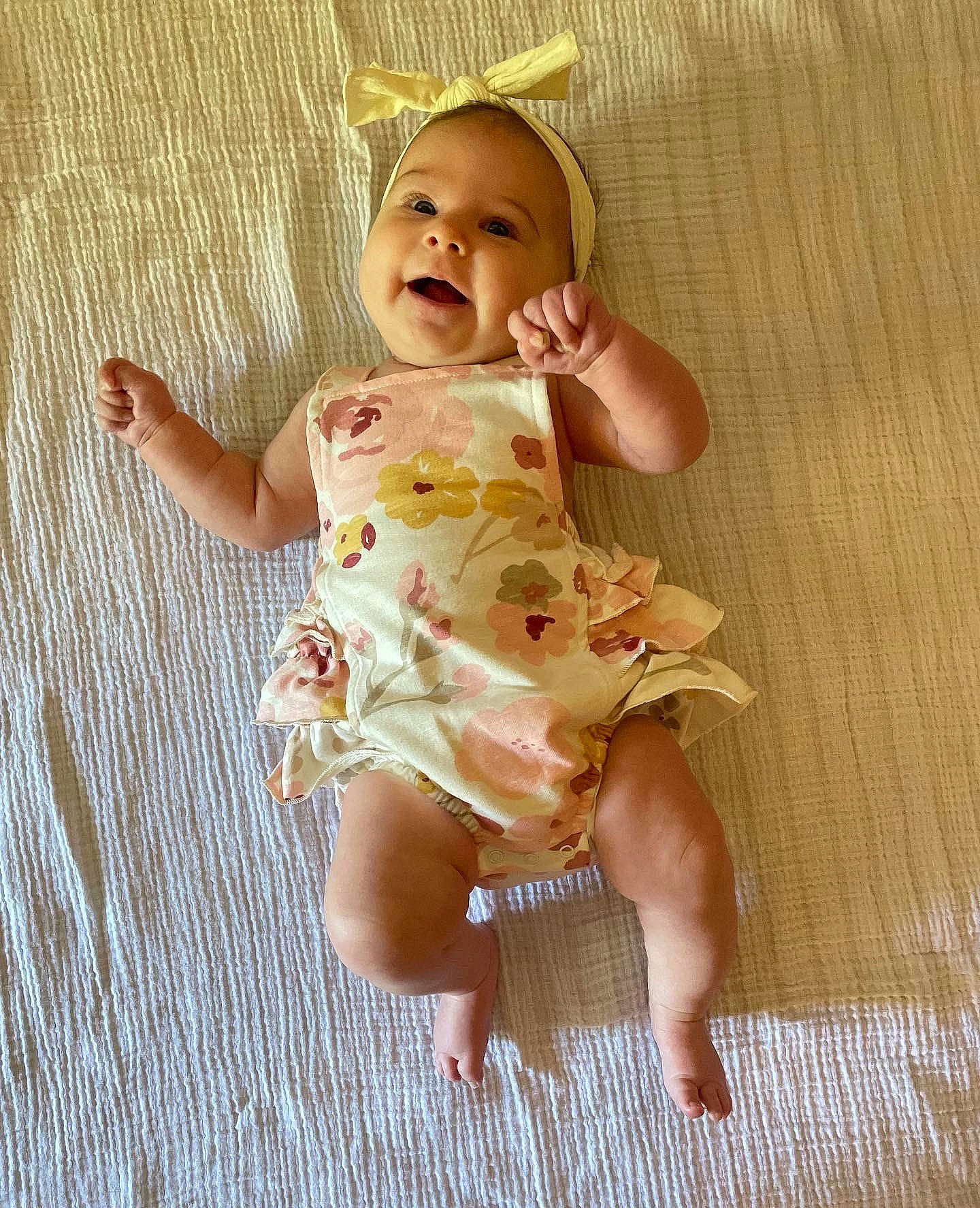 Breelyn is registered to the contest to win money with this photo: baby, baby_toddler_clothing, barefoot, cheek, dress, eye, face, fawn, foot, happy, head, human_leg, iris, pattern, person, skin, sleeve, smile, thigh, thumb