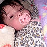 Braelynn is registered to the contest to win money with this photo: baby, pacifier, blanket, leopard_print, onesie, sleepy, face, infant, cozy, soft, brown_eyes, hair, closeup, indoor, child, cute, warm, resting, person, comfort