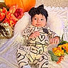 Braelynn is registered to the contest to win money with this photo: baby, infant, headband, pumpkin, flowers, blanket, carpet, fall, autumn, cute, patterned_clothing, socks, indoors, decor, cozy, portrait, child, smiling, relaxed, seasonal