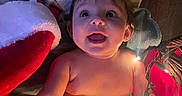Braelynn joined the competition — help win amazing prizes! baby, infant, child, diaper, lights, christmas, holiday, festive, snowman, blanket, santa_hat, smiling, happy, indoors, cute, toddler, face, skin, hand, foot