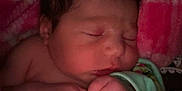 Braelynn is registered to the contest to win money with this photo: newborn, baby, sleeping, blanket, pink, soft, hands, face, peaceful, cozy, infant, wrapped, cute, resting, child, portrait, warm, closeup, indoors, toddler