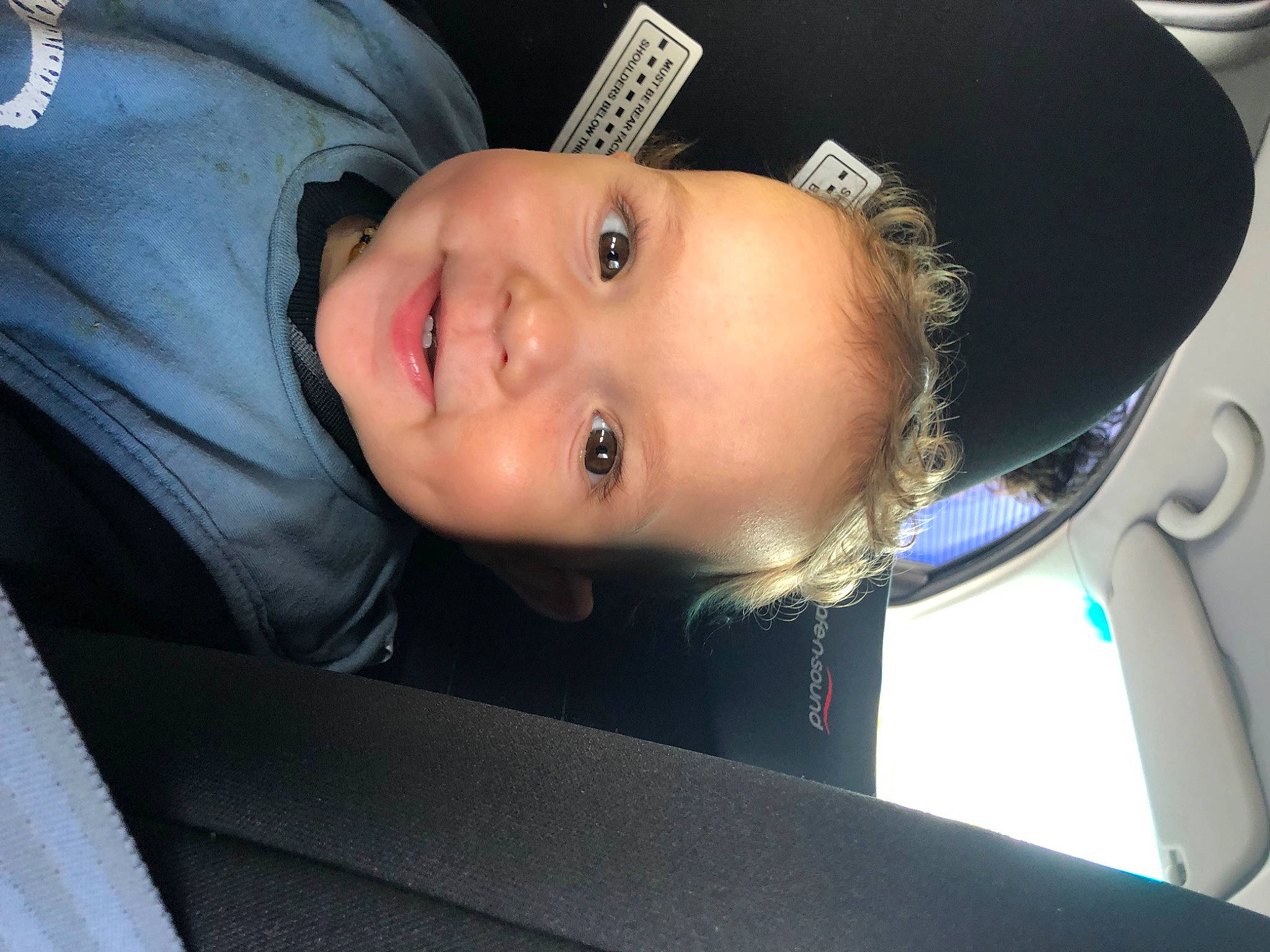 Michael is registered to the contest to win money with this photo: auto_part, automotive_exterior, baby, car_seat, cheek, child, comfort, electric_blue, eyelash, flash_photography, fun, iris, jaw, joy, lip, mouth, nose, person, smile, steering_wheel