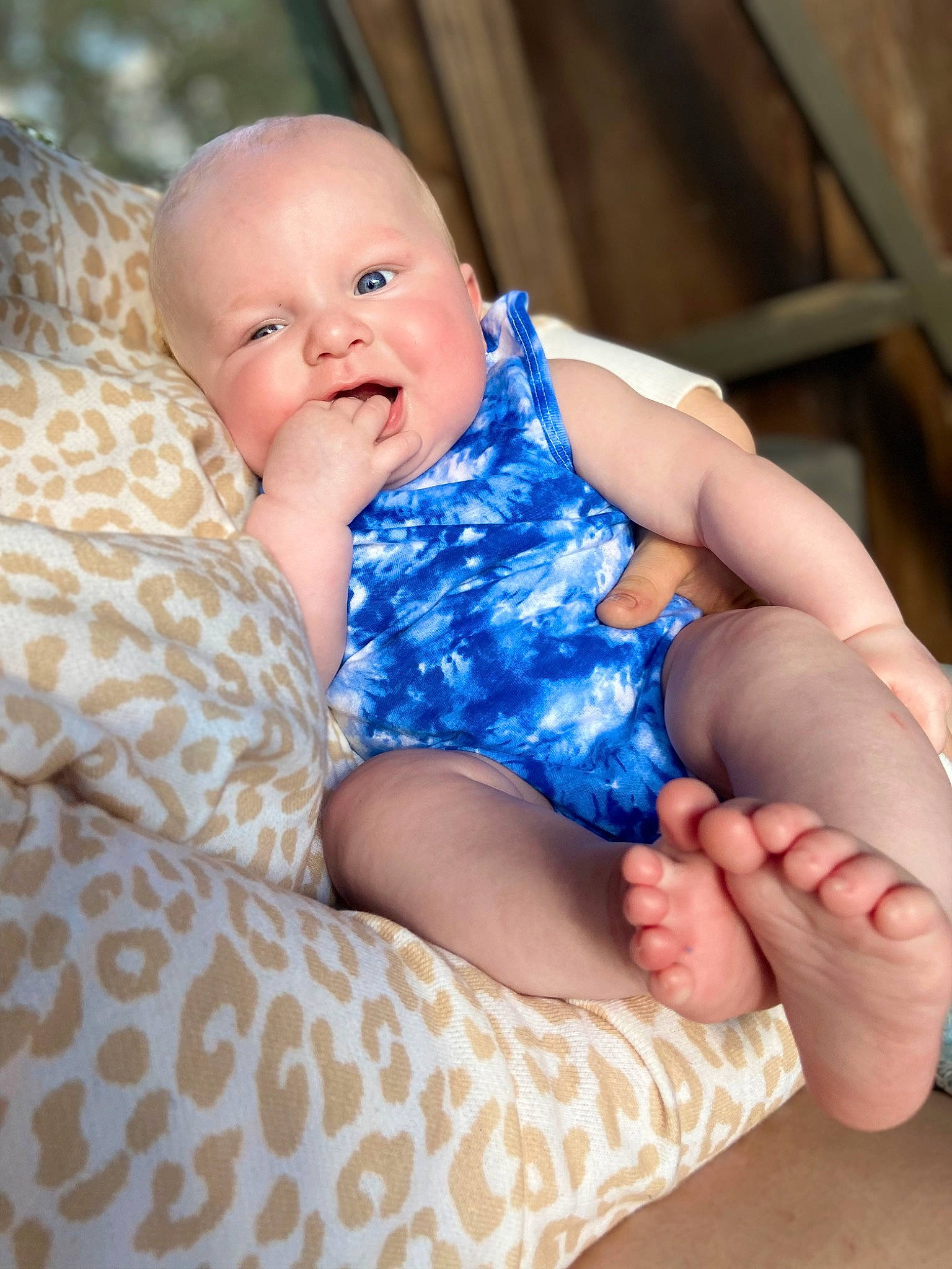 Bradley is registered to the contest to win money with this photo: azure, baby, baby_toddler_clothing, cheek, child, comfort, couch, electric_blue, finger, fun, hand, happy, human_leg, iris, pattern, person, sitting, skin, smile, thigh
