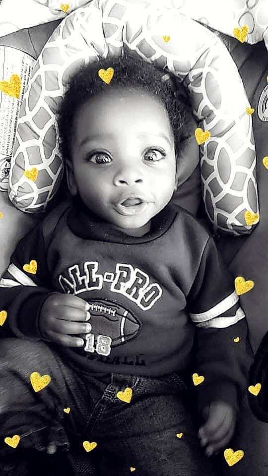 Ezekiel is registered to the contest to win money with this photo: baby_toddler_clothing, cheek, child, cool, eye, face, flash_photography, fun, gesture, hairstyle, happy, logo, monochrome, monochrome_photography, pattern, person, portrait_photography, sleeve, style, t_shirt