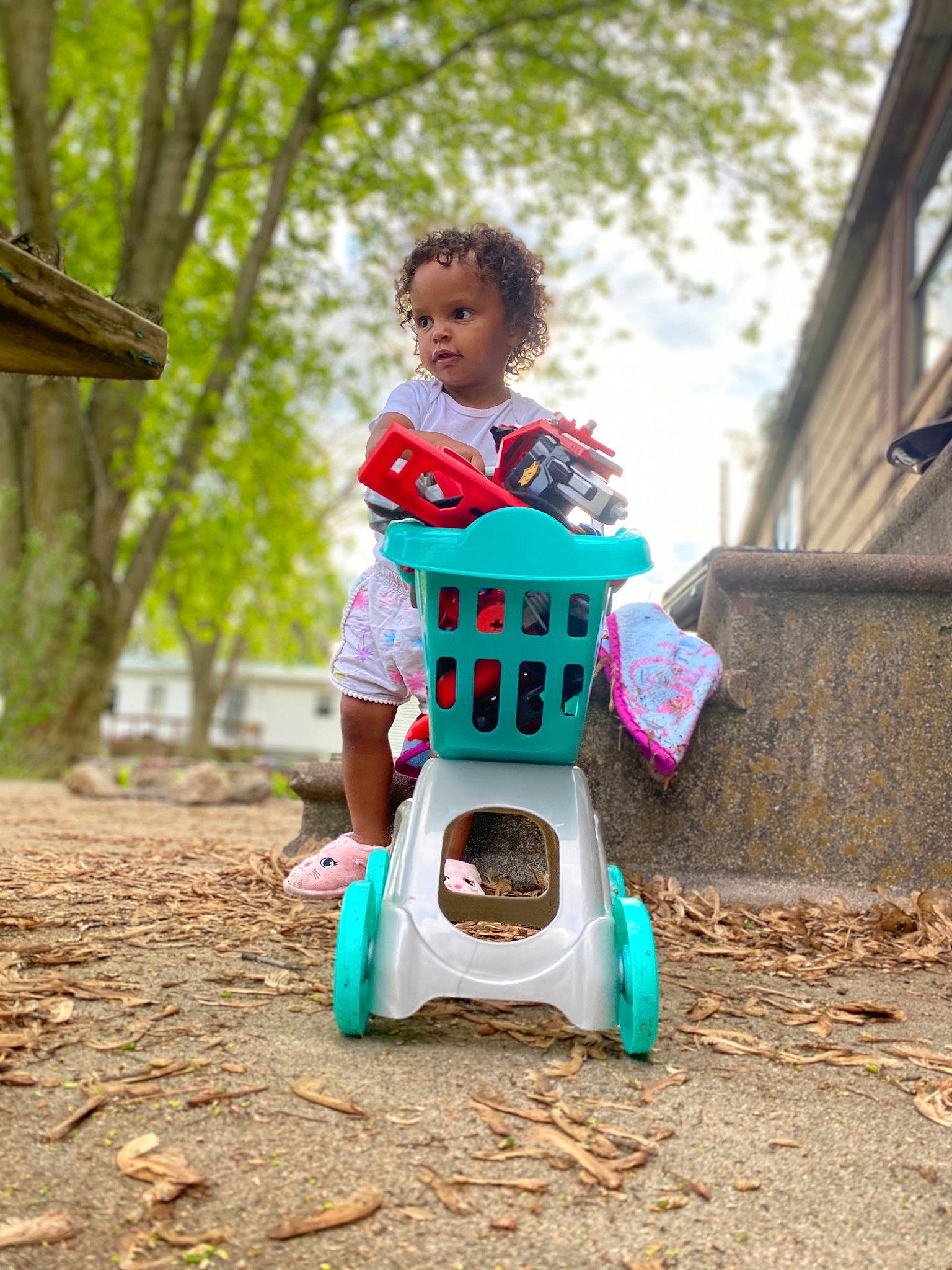 Harmonie is registered to the contest to win money with this photo: baby, baby_products, child, fun, green, happy, leisure, person, photography, play, playground, product, public_space, recreation, riding_toy, sitting, smile, summer, toddler, tree