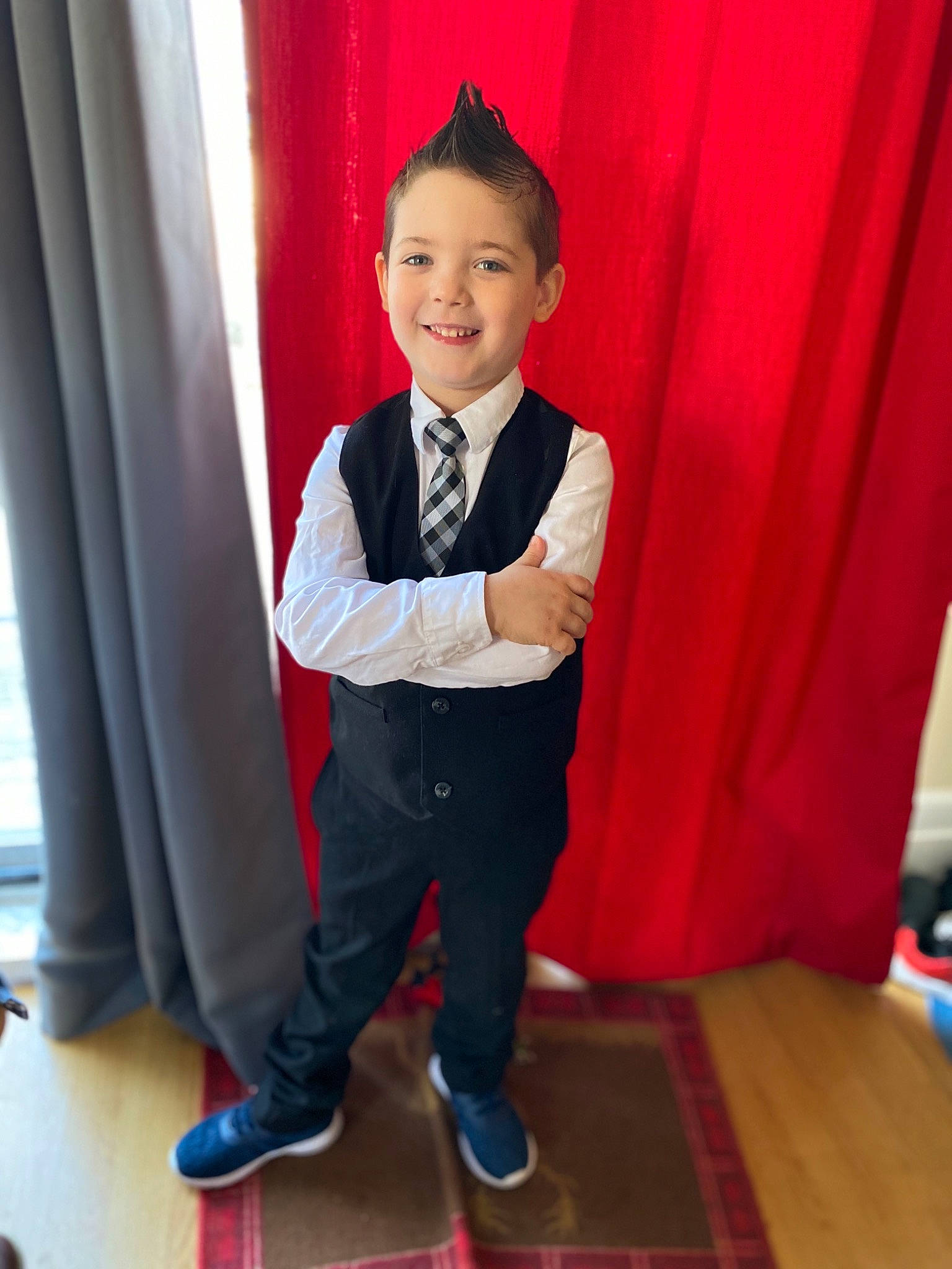 Brayden is registered to the contest to win money with this photo: ceremony, child, formal_wear, happy, joy, outerwear, person, shoe, smile, standing, suit, toddler, tuxedo