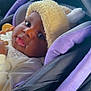 baby, black, car, car_seat, child, closeup, clothing, cozy, cute, eyes, face, fuzzy_hat, hat, indoors, infant, newborn, portrait, purple, seatbelt, young_child