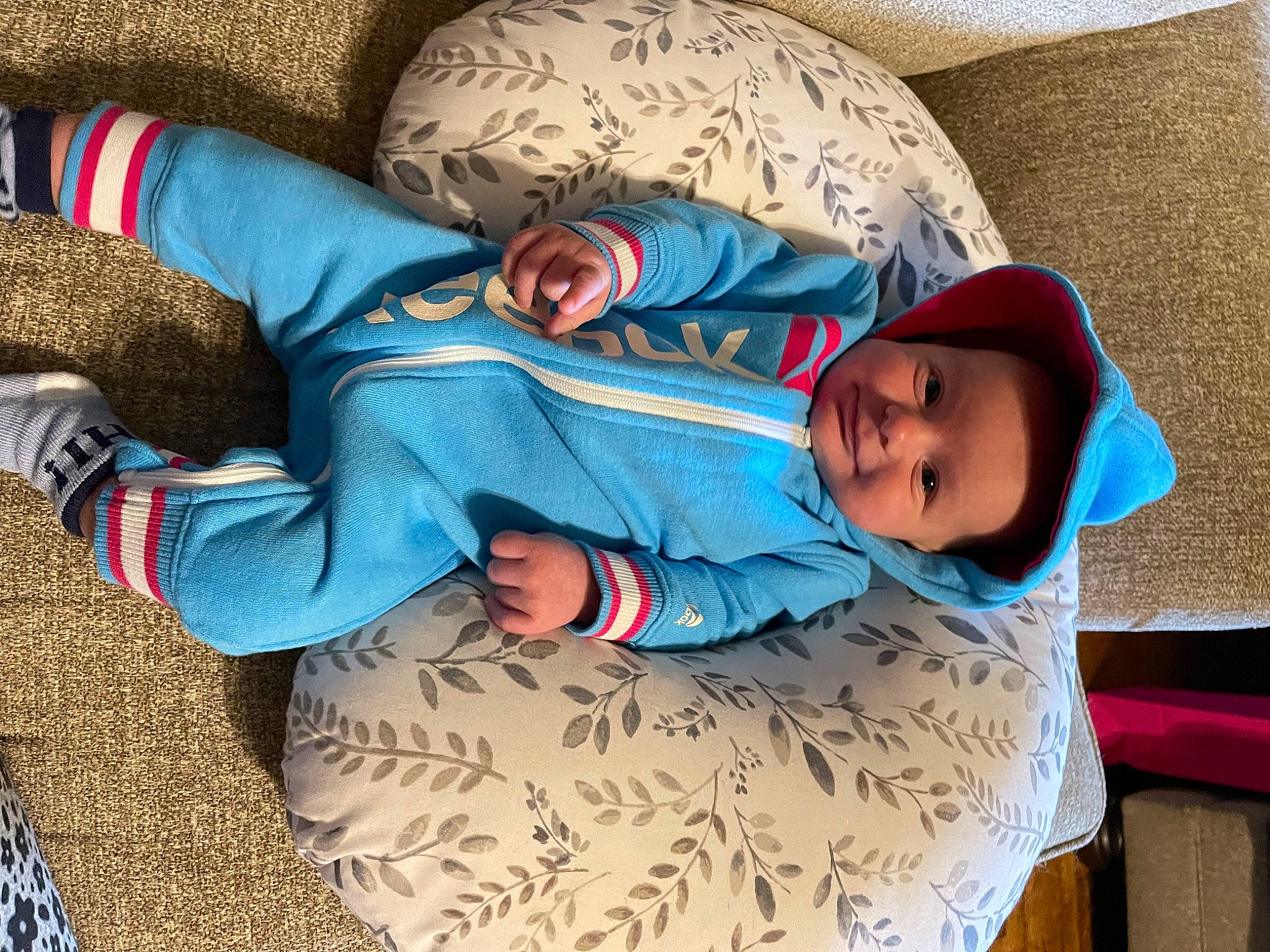Beau is registered to the contest to win money with this photo: azure, baby, baby_sleeping, baby_toddler_clothing, comfort, cool, face, facial_expression, finger, headgear, human, linens, mammal, organ, person, product, sleeve, smile, textile, toddler