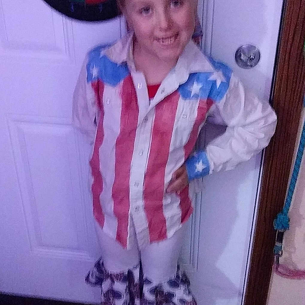 Sapphire is registered to the contest to win money with this photo: child, clothing, costume, door, face, female, footwear, girl, head, homedecor, hosiery, pants, person, photography, portrait, shirt, shoe, shorts, sock, urban