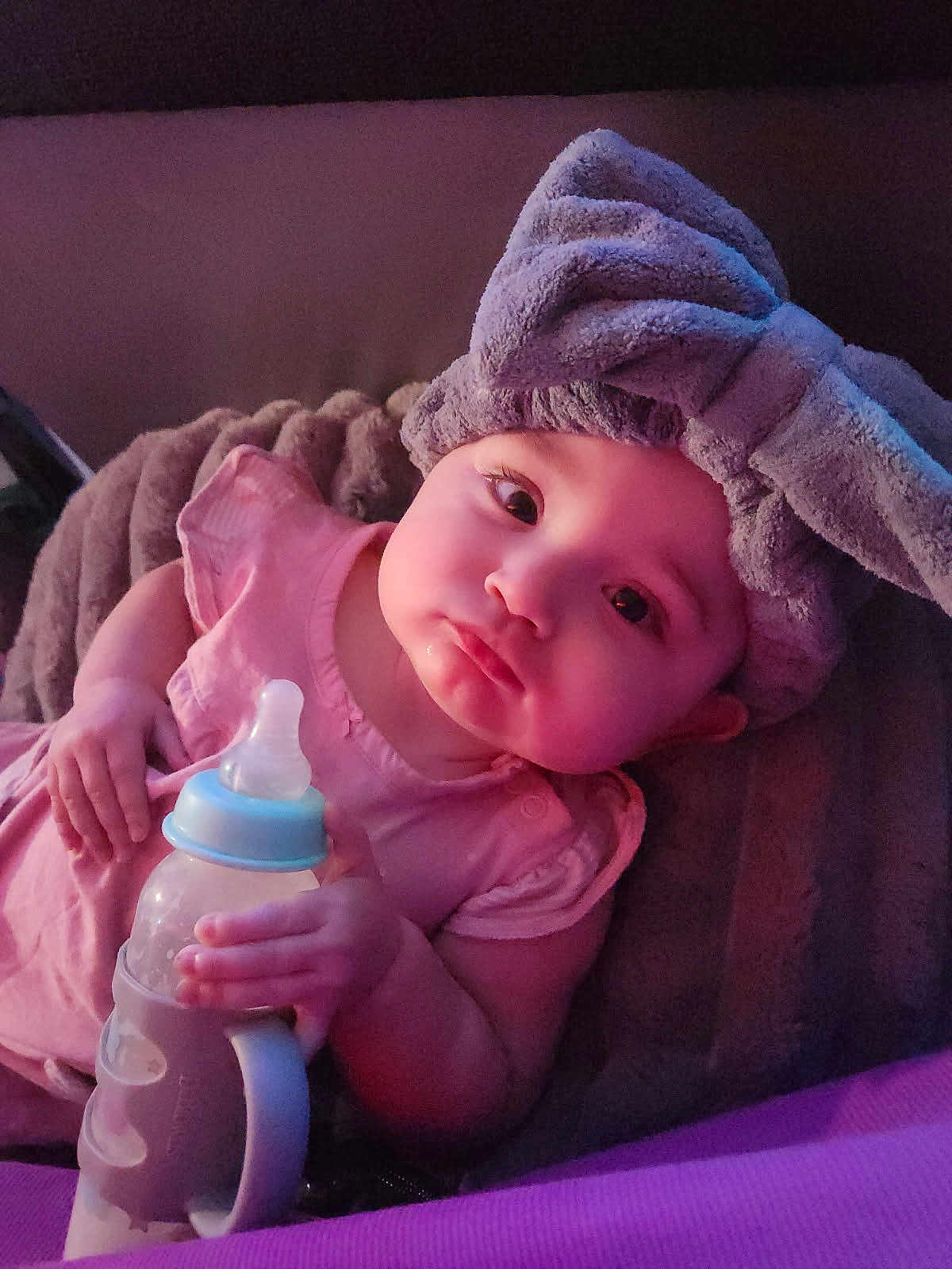 Mercy joined the competition — help win amazing prizes! baby, infant, bottle, headband, bow, pink_clothing, lying_down, hand, face, expression, soft_light, blanket, indoors, cute, child, portrait, young, bottle_holder, sleepwear, resting