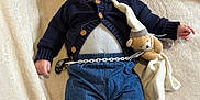 Clément a rejoint le concours — aidez-le/la à gagner de superbes lots ! baby, smiling, dimples, cardigan, denim_pants, plush_toy, pacifier, blanket, cozy, infant, cute, lying_down, soft_toy, rolled_pants, socks, happy, indoors, child, comfort, toddler