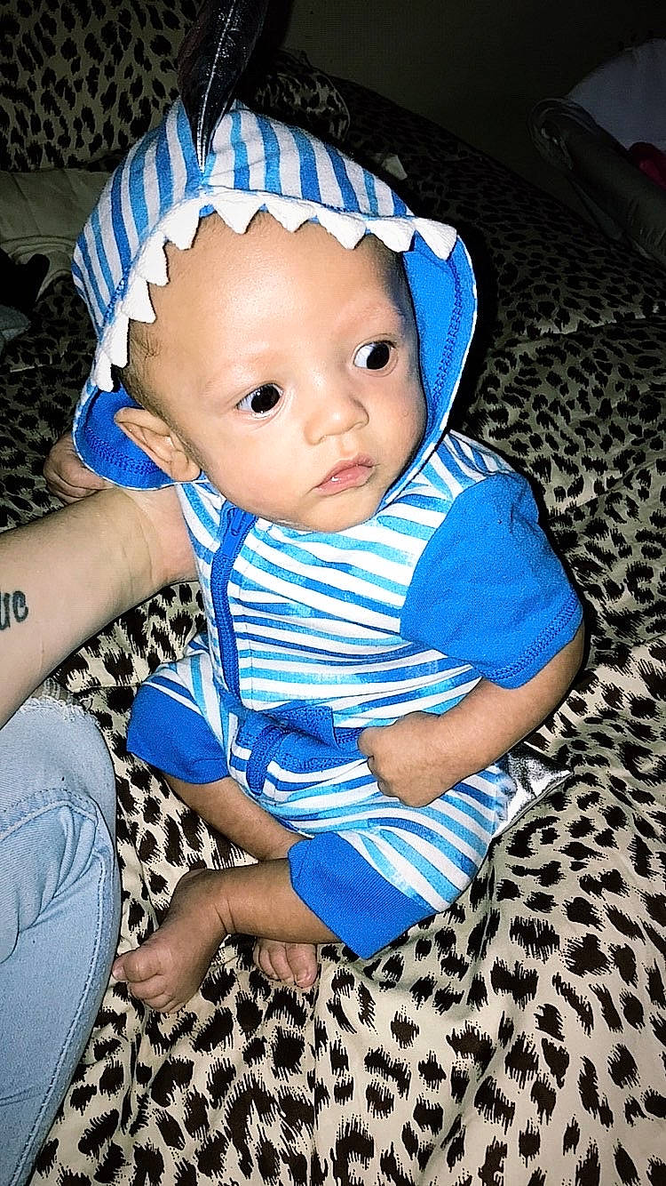 Lucious joined the competition — help win amazing prizes! baby, baby_toddler_clothing, blue, cap, cheek, child, costume_hat, doll, electric_blue, eye, face, fashion_accessory, flash_photography, happy, hat, iris, pattern, person, sitting, toddler