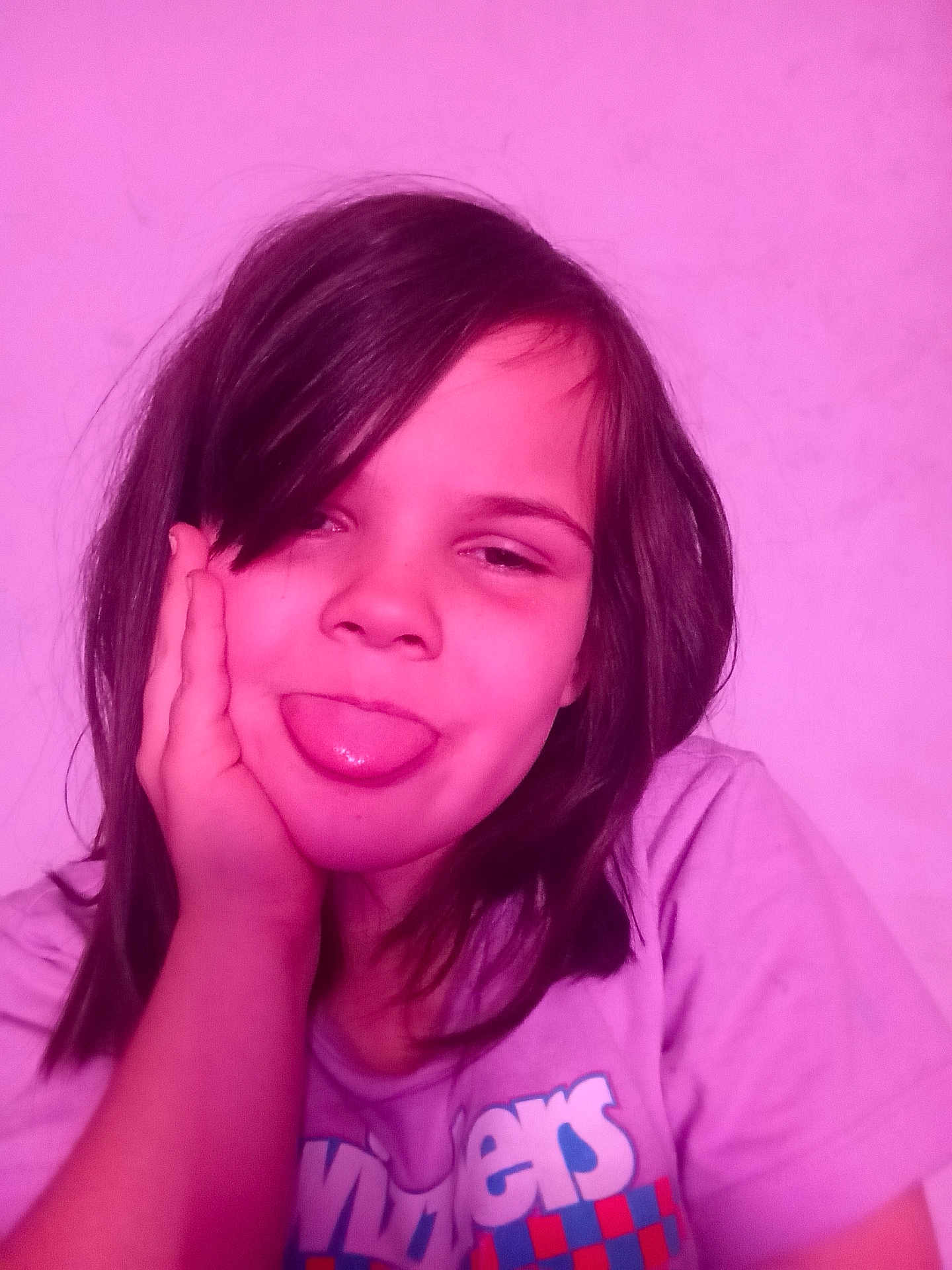 Olivia joined the competition — help win amazing prizes! child, face, tongue_out, hand, hair, pink_light, portrait, playful, smile, tshirt, casual, indoor, person, young, cute, expression, fun, head, relaxed, happy