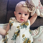 Ariya joined the competition — help win amazing prizes! baby, child, girl, plush_toy, bunny, headband, bow, dress, floral_pattern, couch, blanket, indoor, portrait, cute, expression, person, young_child, sitting, soft_toy, casual