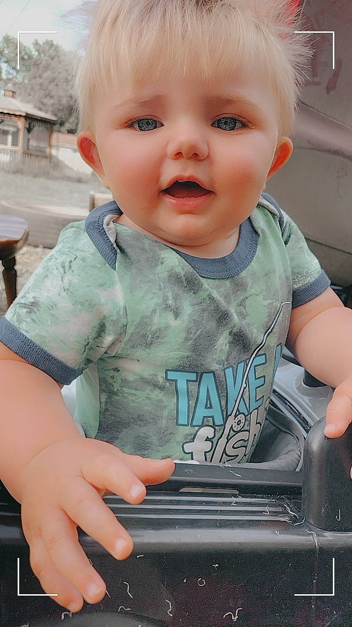 Kamran is registered to the contest to win money with this photo: baby, baby_toddler_clothing, cheek, child, chin, cool, eye, facial_expression, finger, hair, hairstyle, happy, human_body, mouth, people, person, skin, sleeve, smile, t_shirt