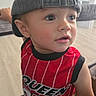 Aiden joined the competition — help win amazing prizes! toddler, child, cap, backward_cap, red_jersey, number_95, indoor, home, curious, expression, face, portrait, clothing, young_child, person, casual, cute, looking_away, soft_light, floor