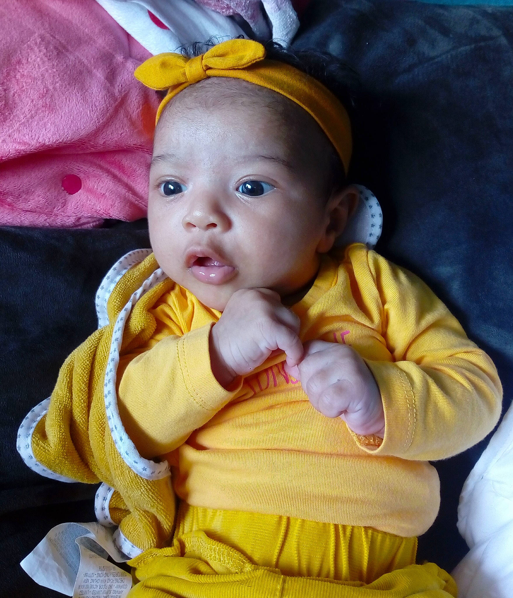 Calista participe au concours pour gagner de l'argent avec cette photo : baby, baby_products, baby_toddler_clothing, cheek, chin, comfort, costume_hat, dress, eye, face, happy, head, iris, nose, outerwear, person, skin, sleeve, textile, toddler