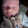 Tobias is registered to the contest to win money with this photo: baby, sleeping, infant, face, cute, cozy, bear_design, clothing, soft_light, shadow, hand, newborn, peaceful, portrait, indoors, child, young, closeup, resting, warm