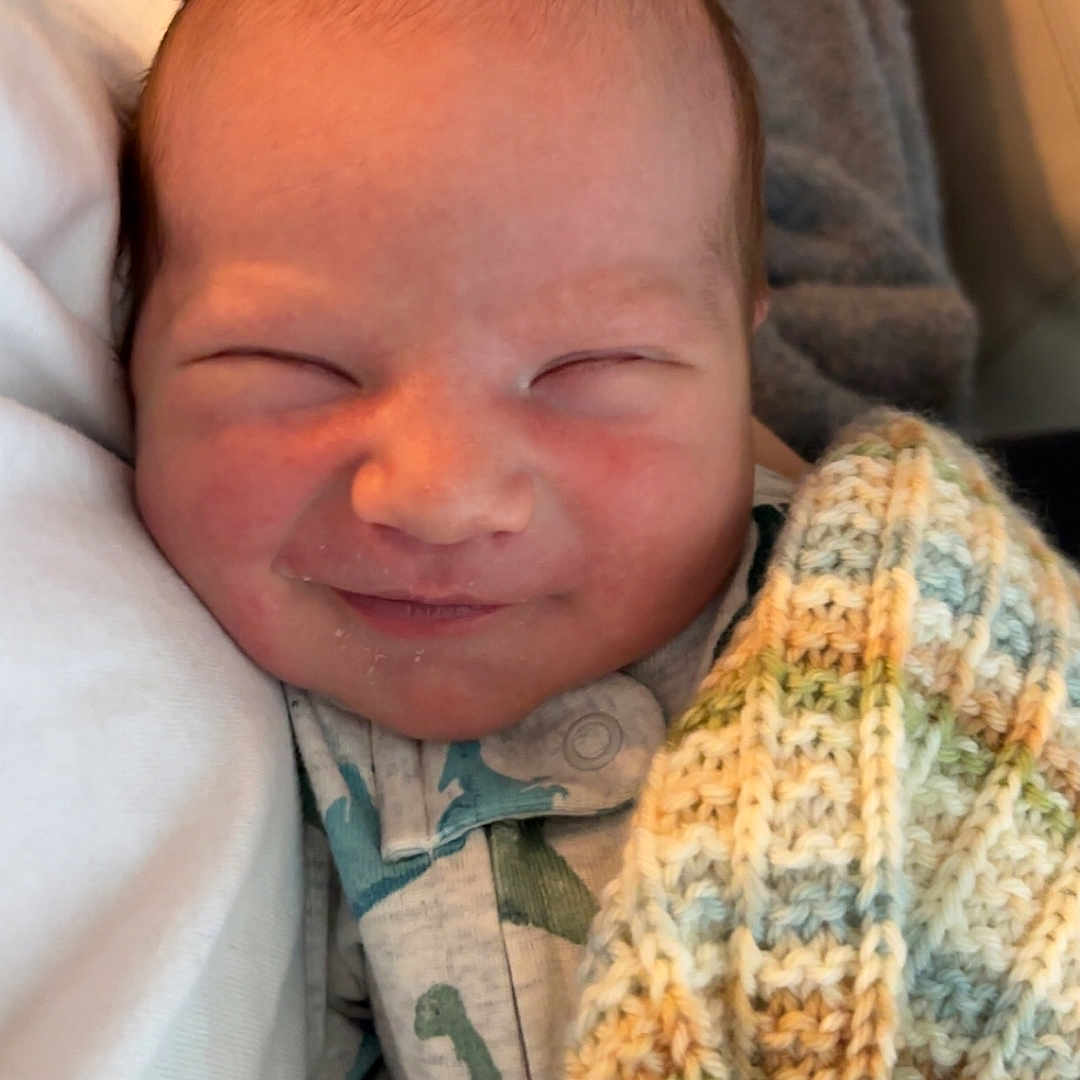 Denny joined the competition — help win amazing prizes! baby, blanket, closeup, clothing, comfort, cute, face, head, indoor, infant, knit, newborn, pale_skin, person, rest, sleeping, smile, soft, tiny, warm