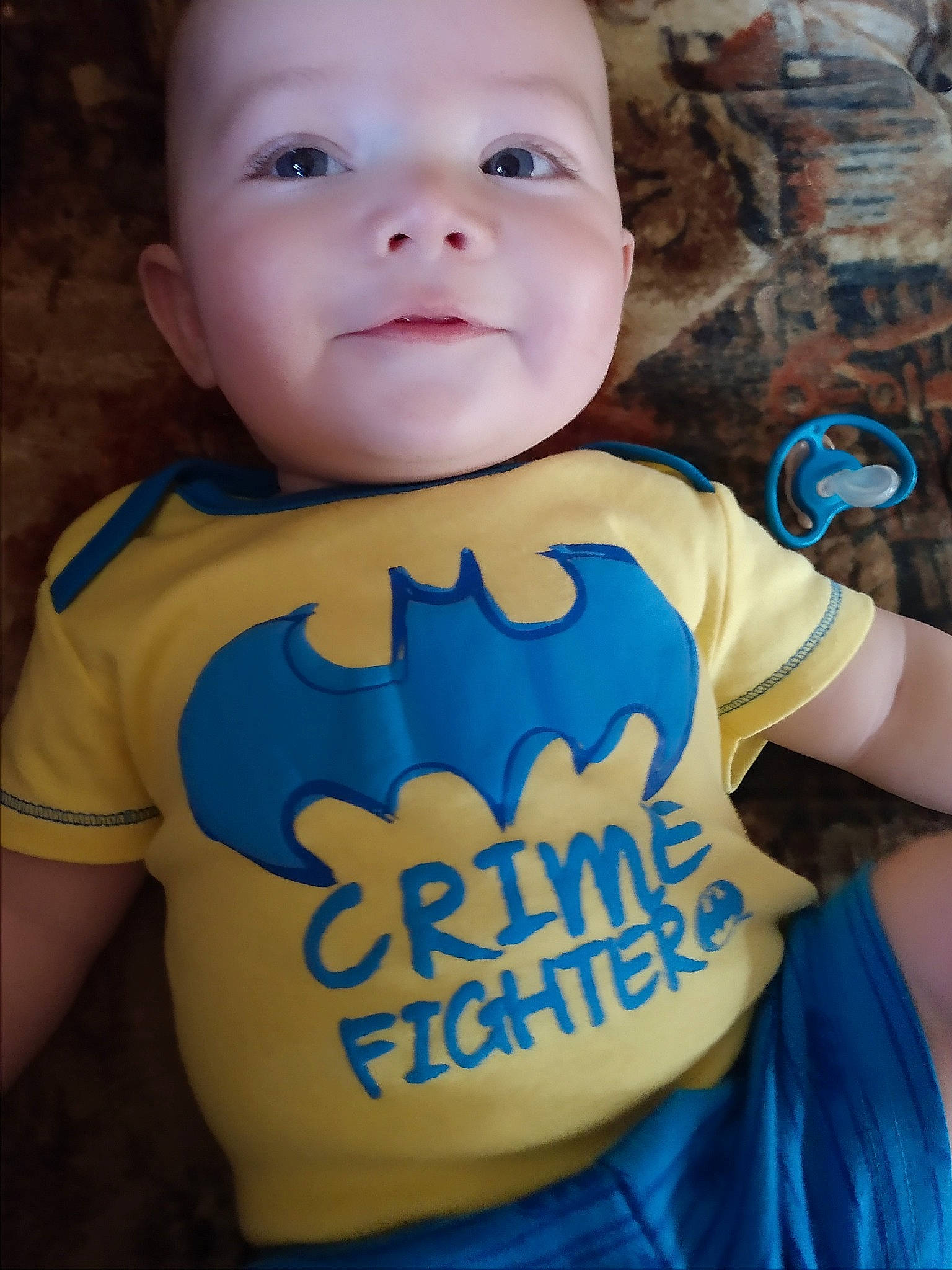 Clinton is registered to the contest to win money with this photo: baby, baby_toddler_clothing, blue, cheek, child, chin, cool, electric_blue, face, lip, male, person, skin, sleeve, smile, t_shirt, toddler