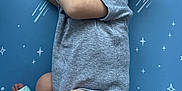 Xavier is registered to the contest to win money with this photo: baby, newborn, sleeping, infant, blanket, stars, blue_background, onesie, mittens, diaper, peaceful, portrait, cute, small, resting, child, soft_lighting, indoors, sleep, face