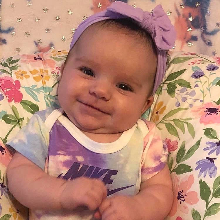 Julie joined the competition — help win amazing prizes! baby, baby_toddler_clothing, cheek, chin, eye, eyebrow, eyelash, facial_expression, happy, iris, joy, lip, nose, person, pink, plant, product, skin, sleeve, smile