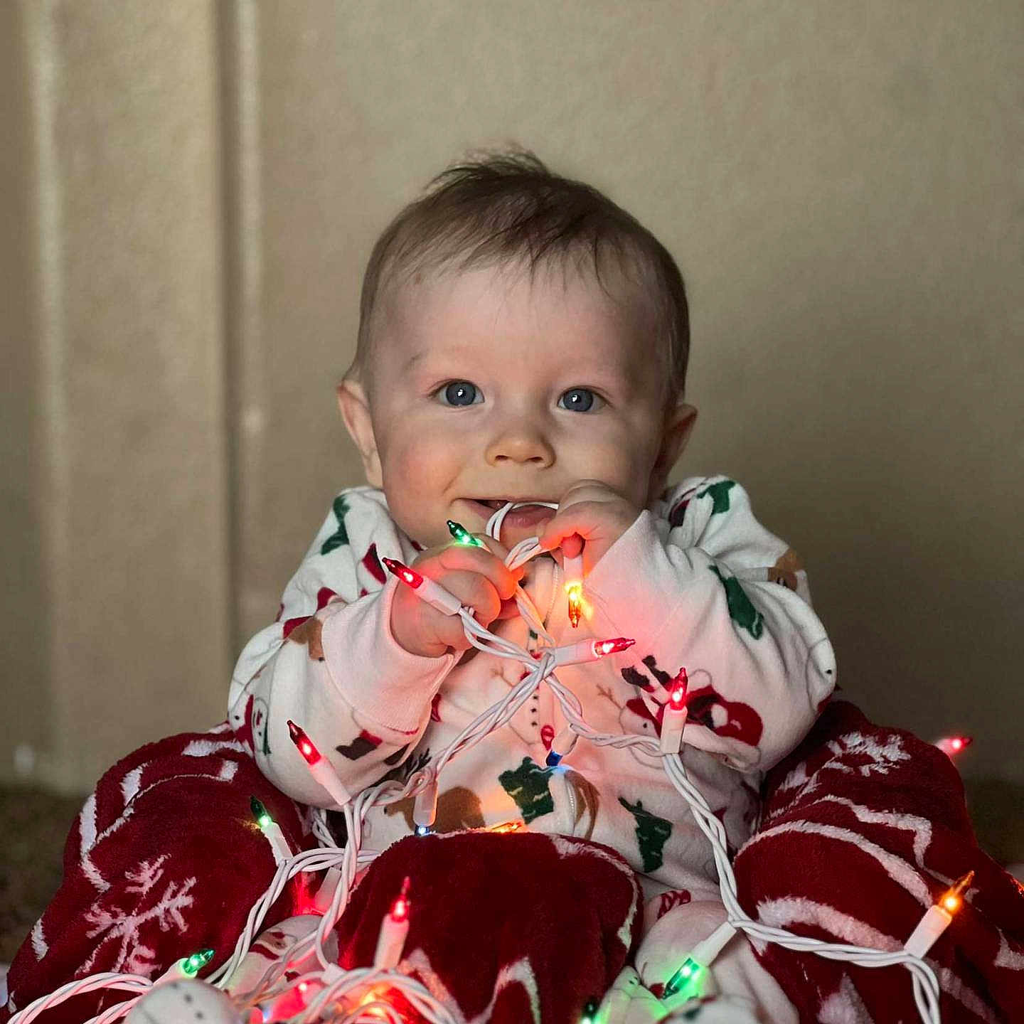 Kaylub is registered to the contest to win money with this photo: baby, biting, blanket, clothing, coat, couch, eating, face, festival, food, furniture, happy, head, jacket, lighting, person, photography, portrait, sitting, smile