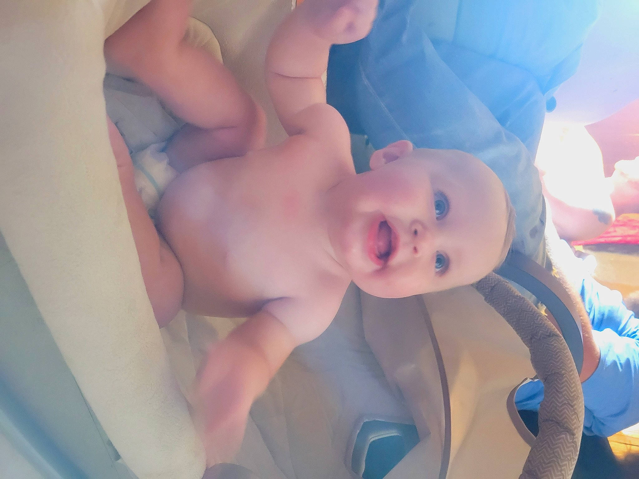 Ava is registered to the contest to win money with this photo: arm, baby, chest, eyebrow, facial_expression, finger, happy, head, human_body, joint, leg, lip, mouth, neck, nose, person, skin, smile, stomach, thigh