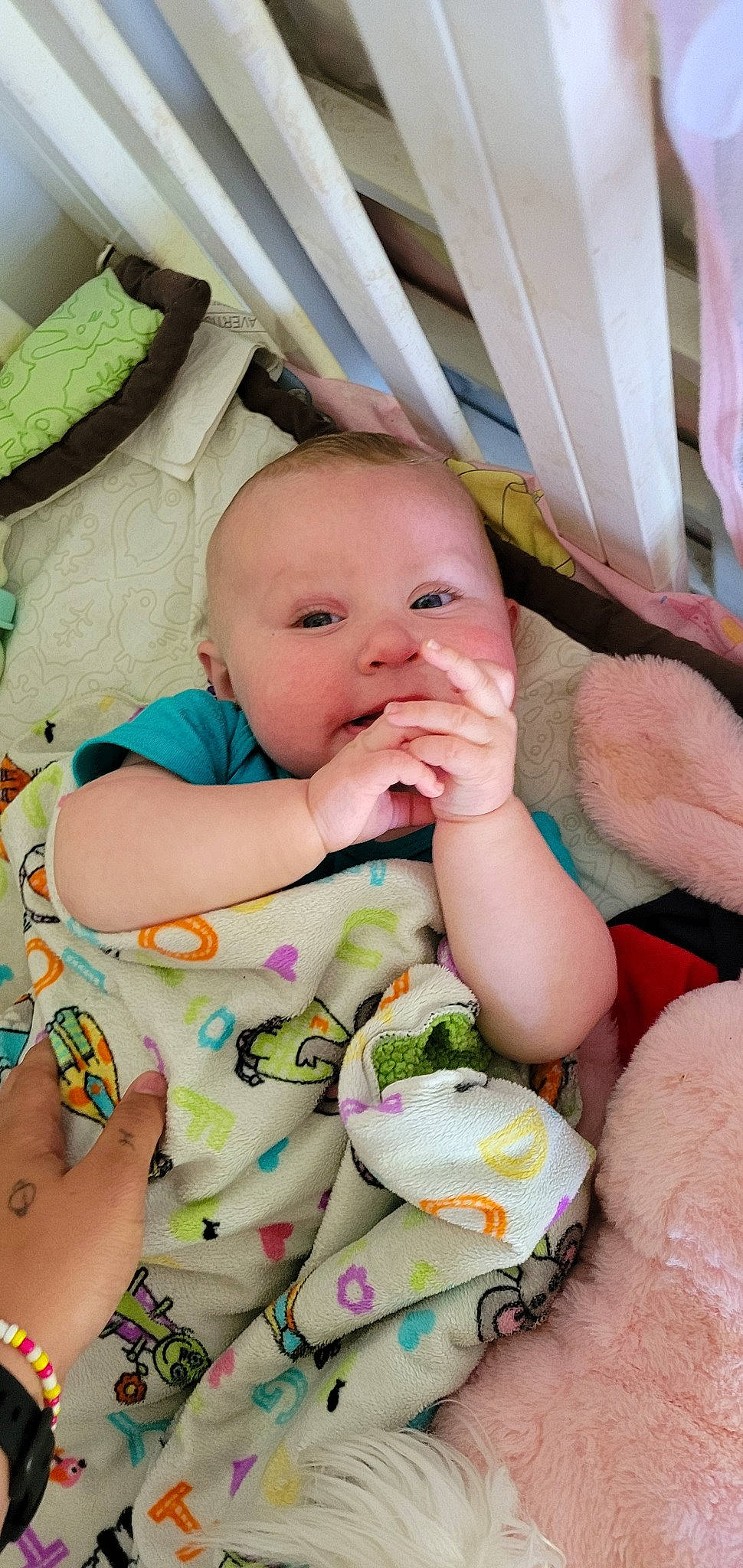 Ava is registered to the contest to win money with this photo: baby, baby_products, baby_toddler_clothing, cheek, child, comfort, eye, finger, grass, happy, head, iris, linens, mouth, person, pink, sitting, skin, smile, textile