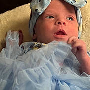 Raelynn Grace joined the competition — help win amazing prizes! baby, infant, headband, blue_dress, blanket, closeup, face, newborn, child, portrait, cute, soft_fabric, hand, eyes, expression, indoor, skin, person, young, adorable