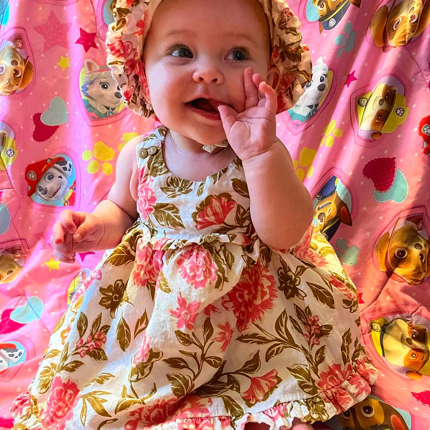 Luna-Rayne is registered to the contest to win money with this photo: baby, biting, bonnet, clothing, dress, eating, face, food, happy, hat, head, person, photography, portrait, sitting, sleeve, smile, yawning