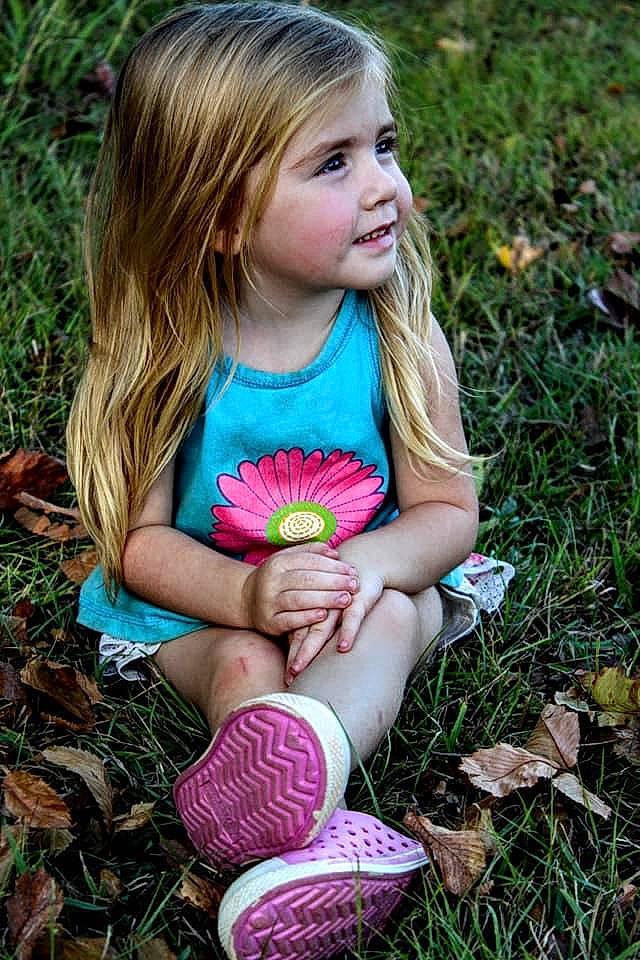 Makenna joined the competition — help win amazing prizes! brown_hair, child, child_model, dress, flower, grass, pattern, people_in_nature, person, photography, pink, plant, play, portrait, sitting, spring, toddler, wildflower