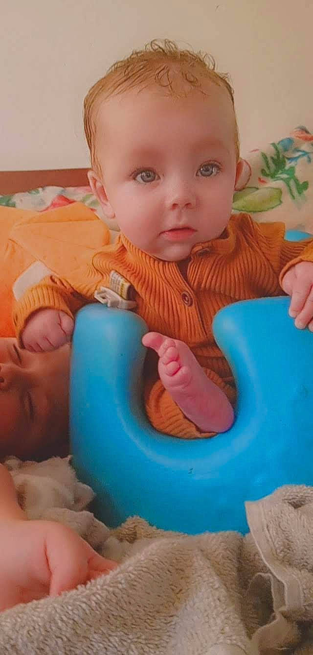 Aj Landon Smith is registered to the contest to win money with this photo: arm, azure, baby, baby_playing_with_toys, baby_toddler_clothing, cheek, child, face, facial_expression, finger, fun, hand, iris, mouth, nose, people, person, product, skin, thumb