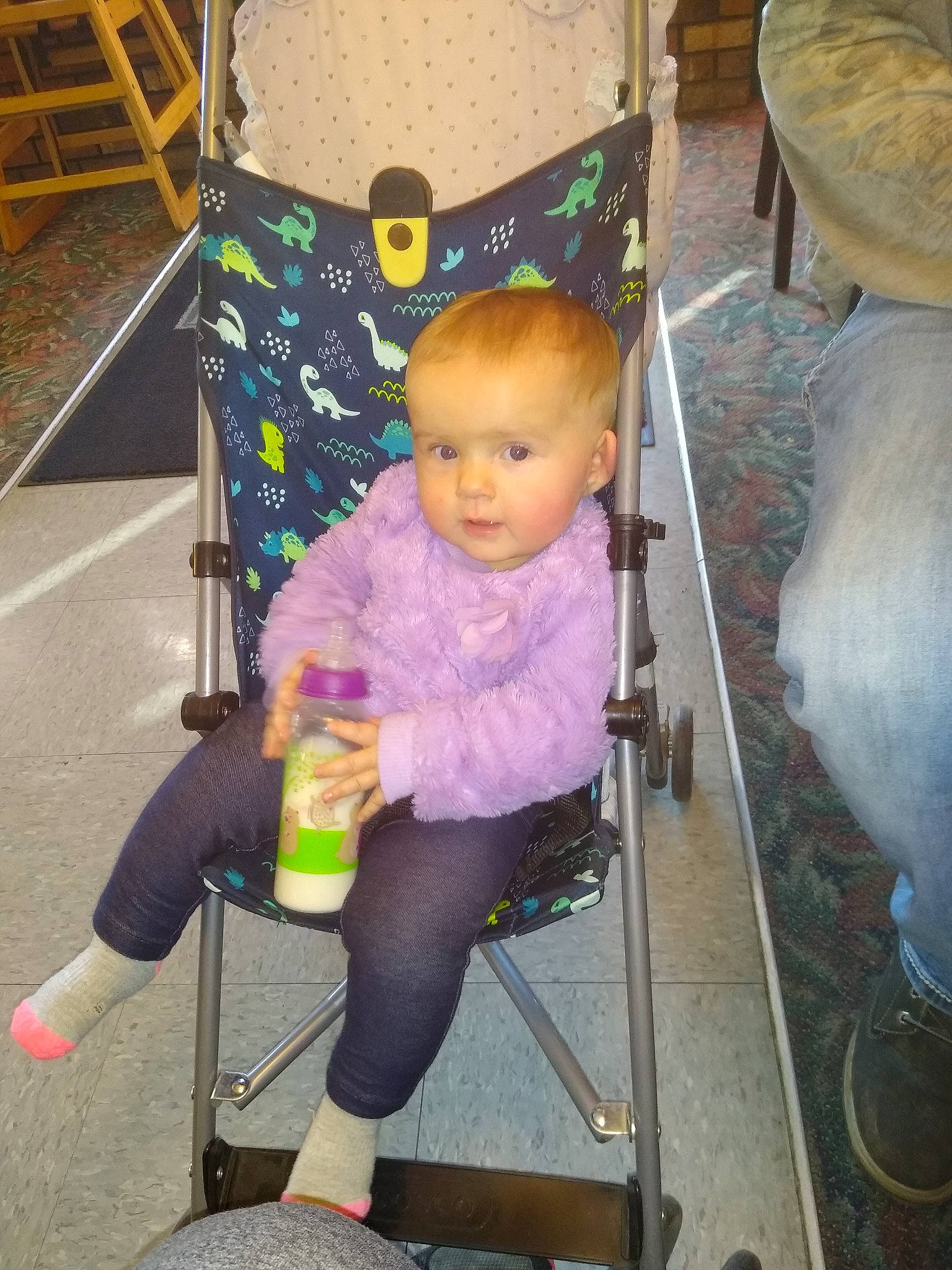 Amelia joined the competition — help win amazing prizes! baby, baby_carriage, baby_products, baby_toddler_clothing, child, comfort, fun, green, head, human_leg, knee, lap, leg, leisure, magenta, person, sitting, standing, tire, toddler