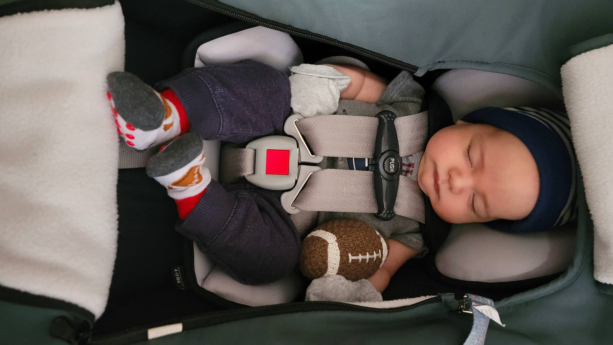 Westin is registered to the contest to win money with this photo: arm, auto_part, baby, baby_carriage, baby_products, baby_sleeping, baby_toddler_clothing, car_seat, child, comfort, elbow, finger, head, headgear, headwear, helmet, human_body, leg, person, personal_protective_equipment
