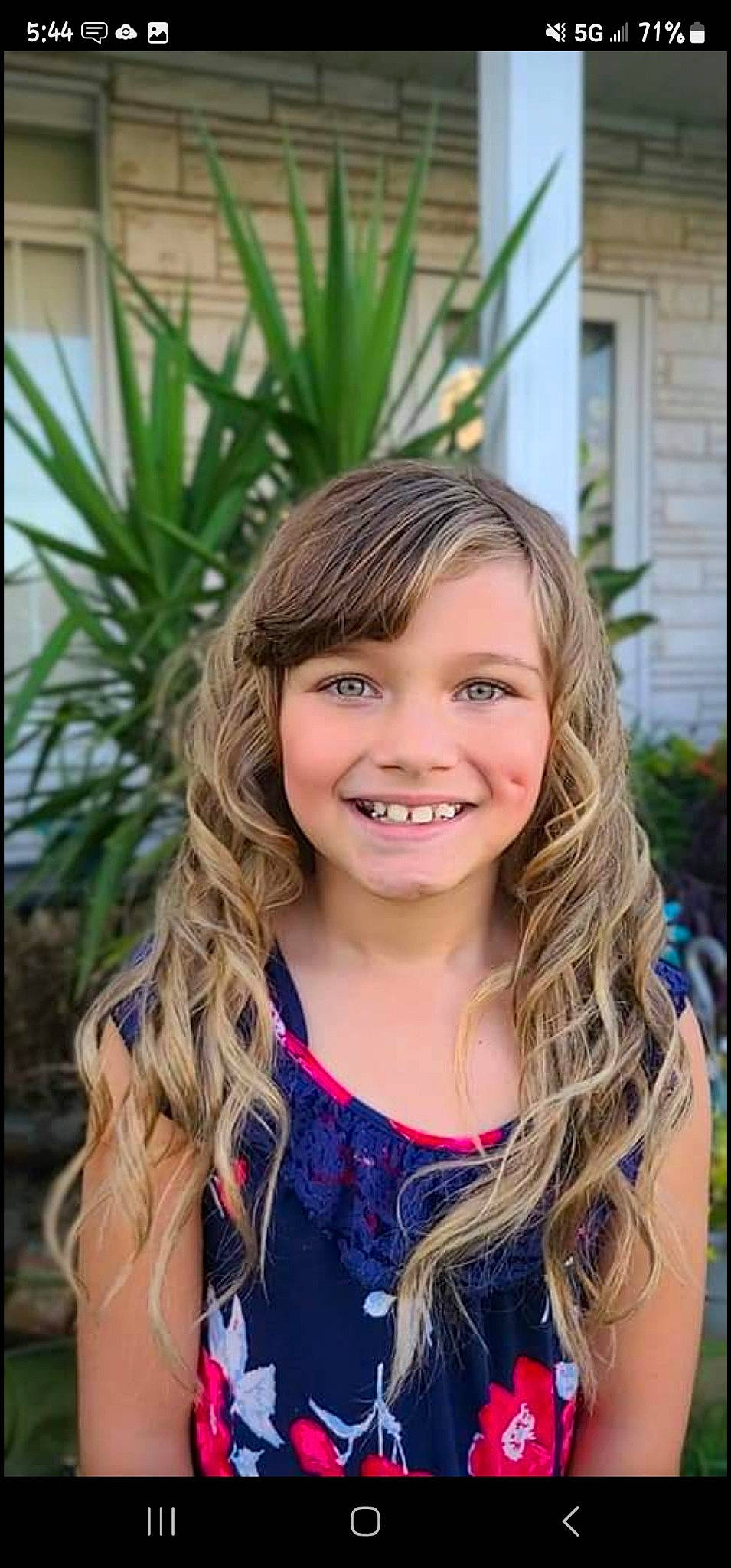 Emily is registered to the contest to win money with this photo: brown_hair, child, electric_blue, eye, eyebrow, flash_photography, fun, grass, happy, iris, joy, layered_hair, leisure, lip, long_hair, people_in_nature, person, plant, smile, summer