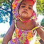 toddler, child, hat, floral, dress, colorful, outdoor, tree, greenery, sunlight, summer, cute, portrait, baby, person, nature, young_child, sunhat, bright, daytime