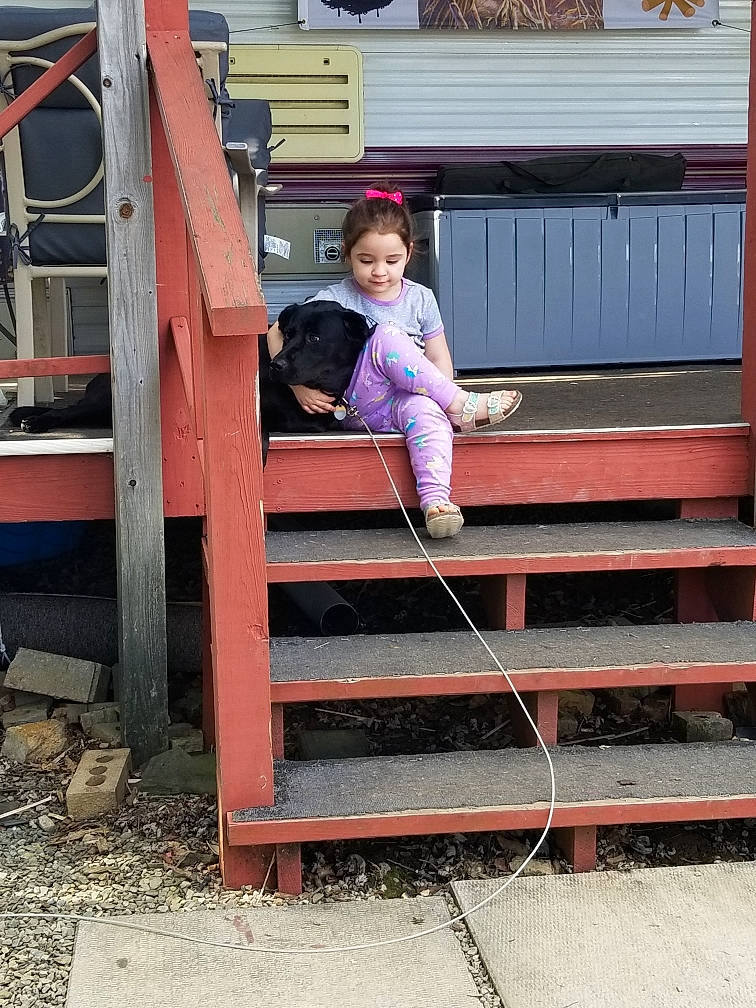 Jem is registered to the contest to win money with this photo: baby_toddler_clothing, child, chute, city, composite_material, concrete, fun, handrail, leisure, magenta, recreation, shorts, sitting, smile, stairs, t_shirt, toddler, transport, vacation, wood