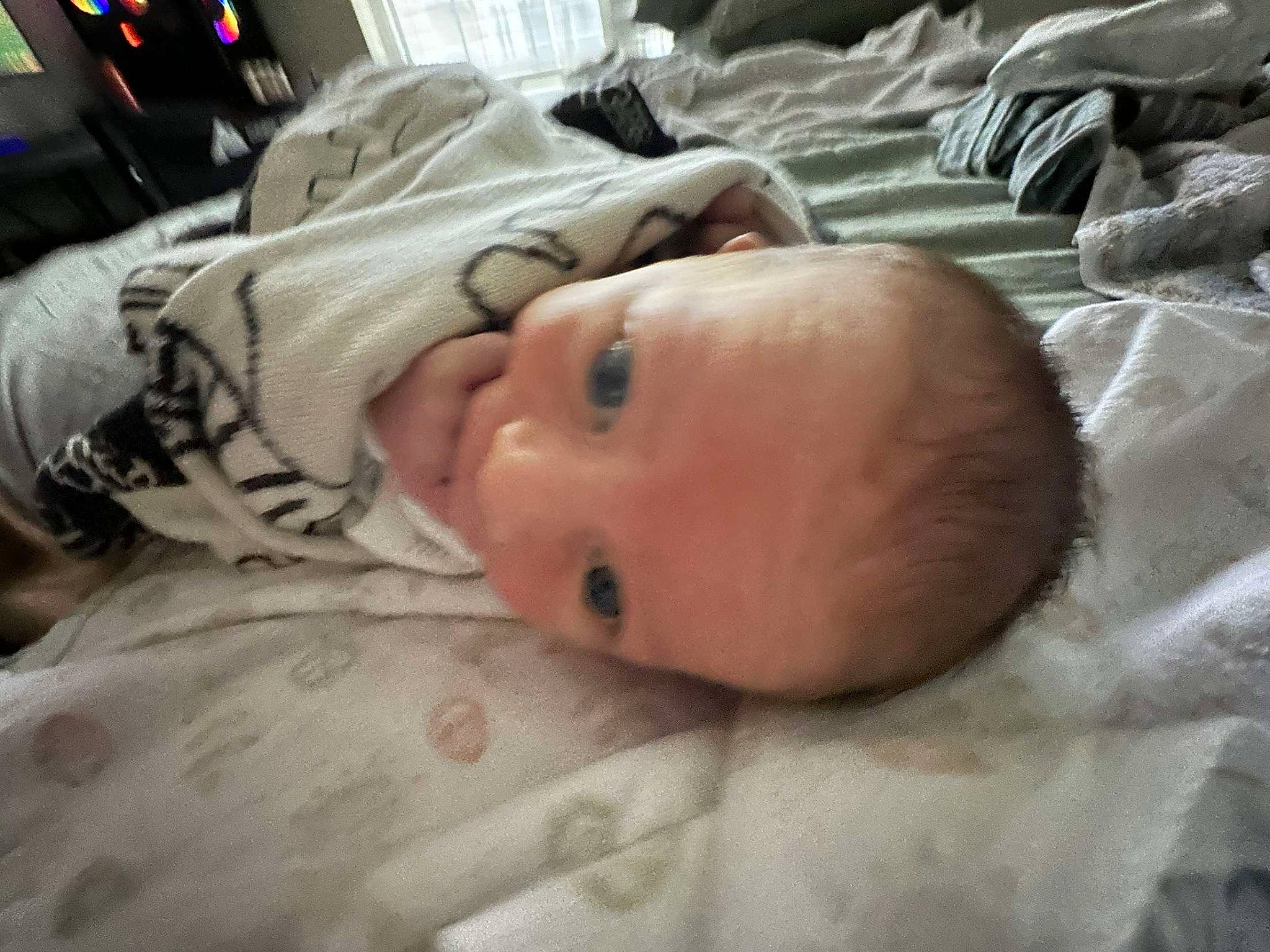 Leif is registered to the contest to win money with this photo: baby, baby_toddler_clothing, bedding, bedtime, cheek, child, comfort, eye, face, head, linens, person, room, skin, sleep, toddler, wood