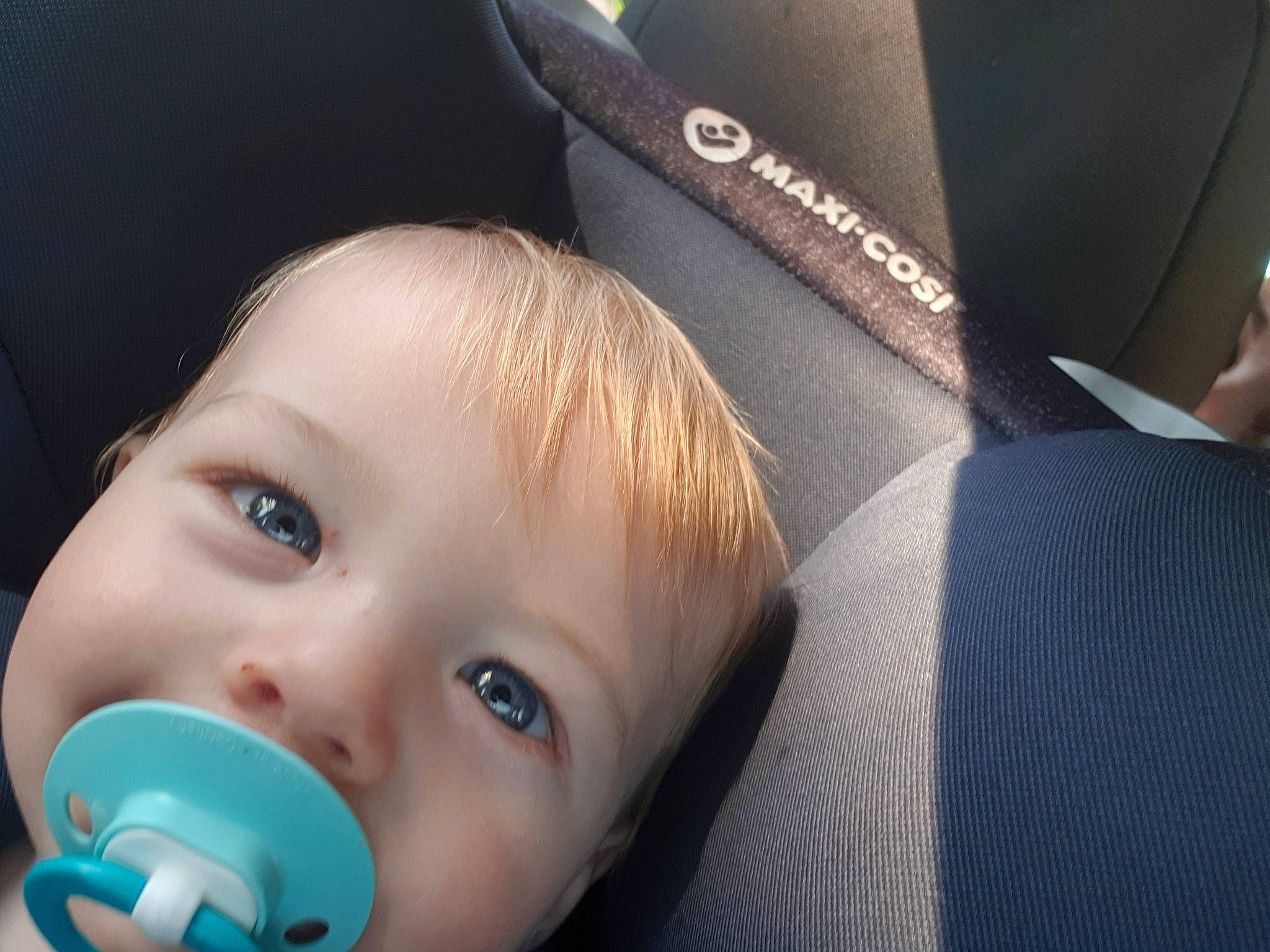 Heath is registered to the contest to win money with this photo: baby, cheek, child, chin, ear, electronic_device, eye, face, fun, head, lip, mouth, neck, nose, person, skin, smile, toddler, vacation