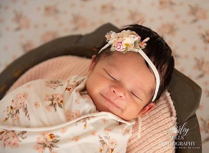 Elle joined the competition — help win amazing prizes! baby, baby_toddler_clothing, brown_hair, cheek, eye, eyebrow, eyelash, face, fashion_accessory, grass, hair_accessory, happy, head, headband, headgear, headpiece, headwear, iris, pattern, person