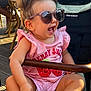 Lucia participe au concours pour gagner de l'argent avec cette photo : toddler, child, sunglasses, pink_clothing, stroller, happy, smiling, outdoor, wooden_deck, summer, baby, casual, cute, seat, footwear, sunlight, daytime, person, playful, fashion