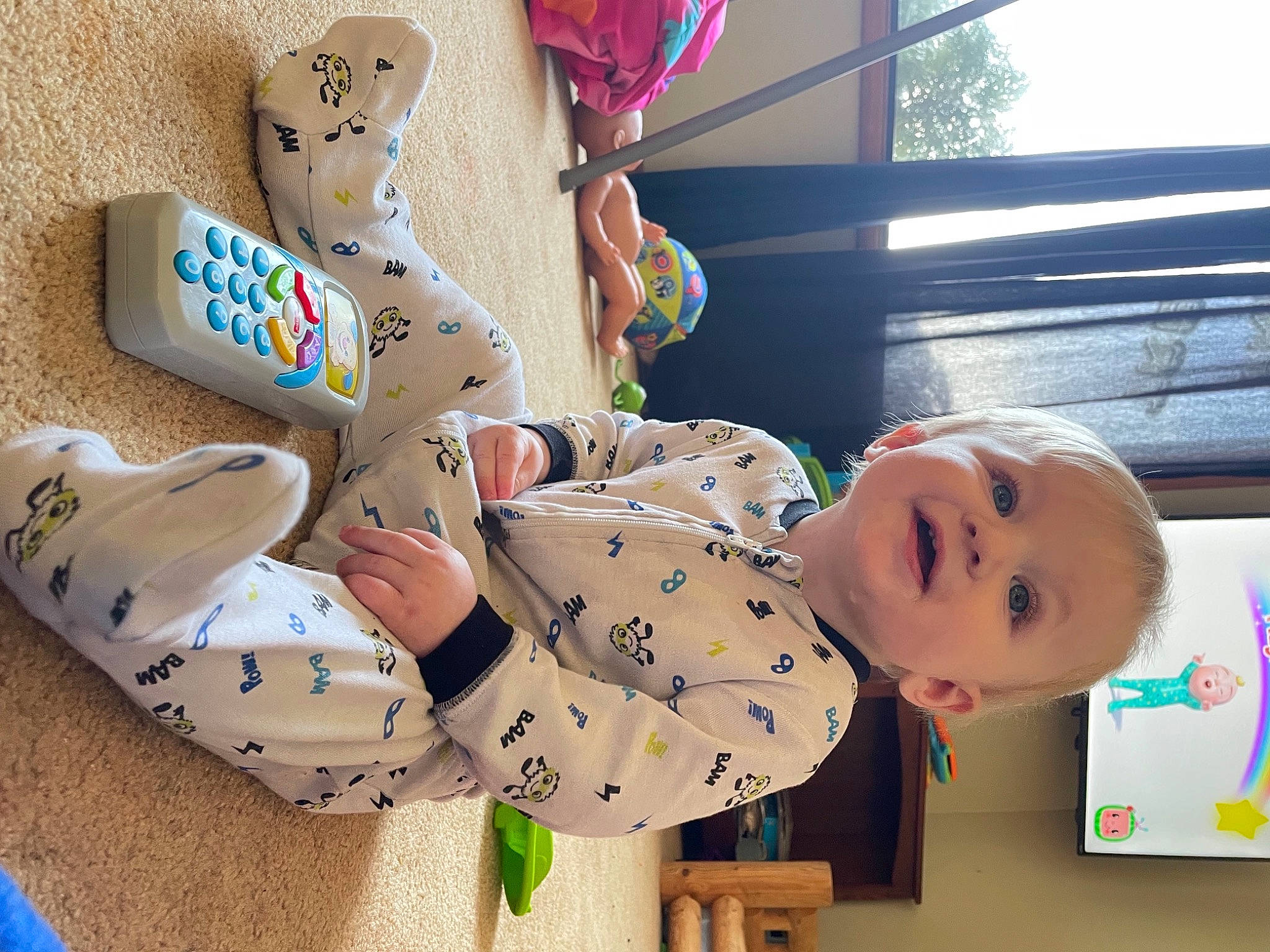 Heath is registered to the contest to win money with this photo: baby, baby_products, baby_toddler_clothing, baby_toys, carmine, child, foot, fun, happy, leisure, pattern, person, play, recreation, room, sitting, smile, toddler, toy, tree
